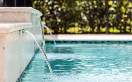 Custom swimming pool waterfall construction